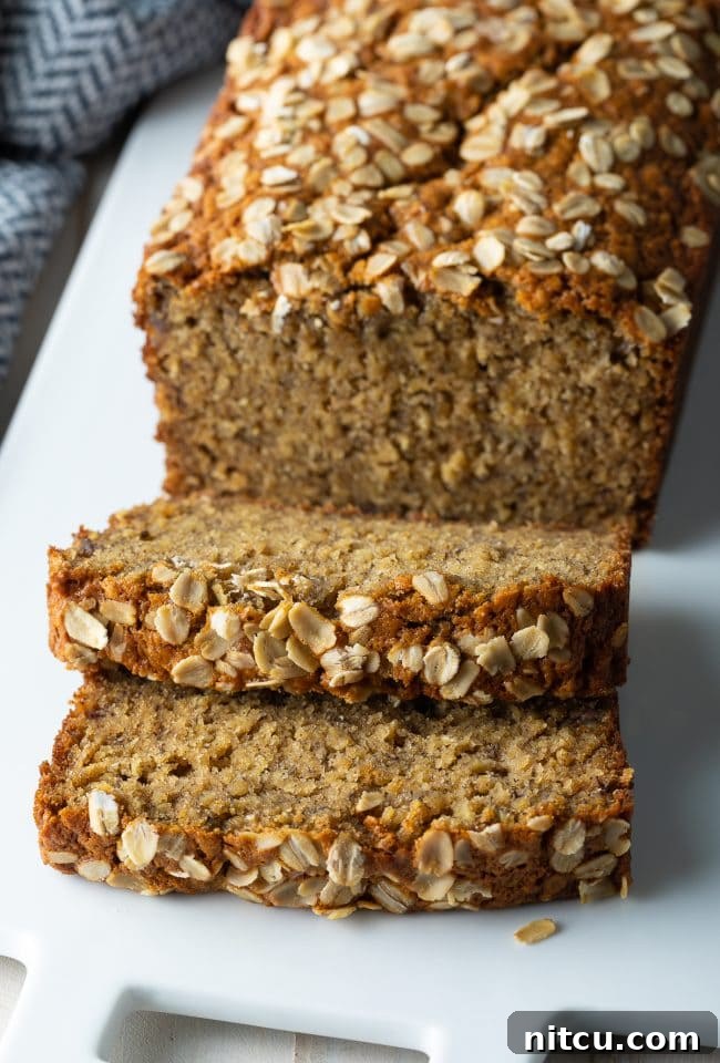 Wholesome Oat & Banana Loaf 2 Delicious banana oat bread slices on a rustic plate, ready to be enjoyed.