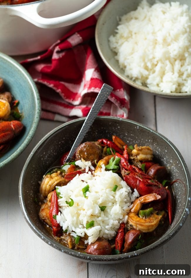 Soulful New Orleans Gumbo 10 seafood cajun gumbo in bowls with scoop of white rice