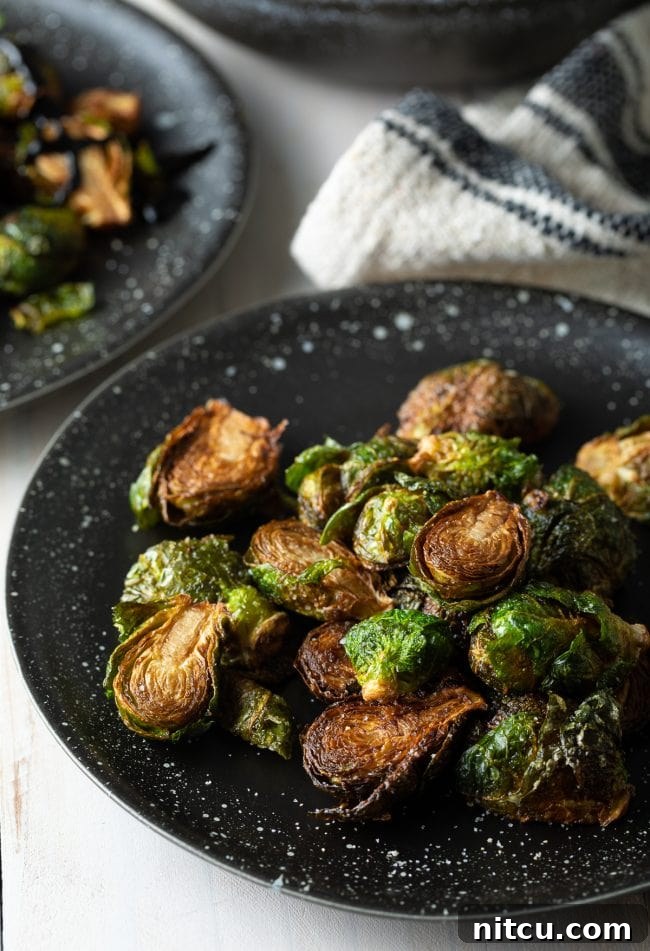 Crispy Golden Brussels Sprouts 10 Plated crispy Brussels sprouts, elegantly arranged and garnished.