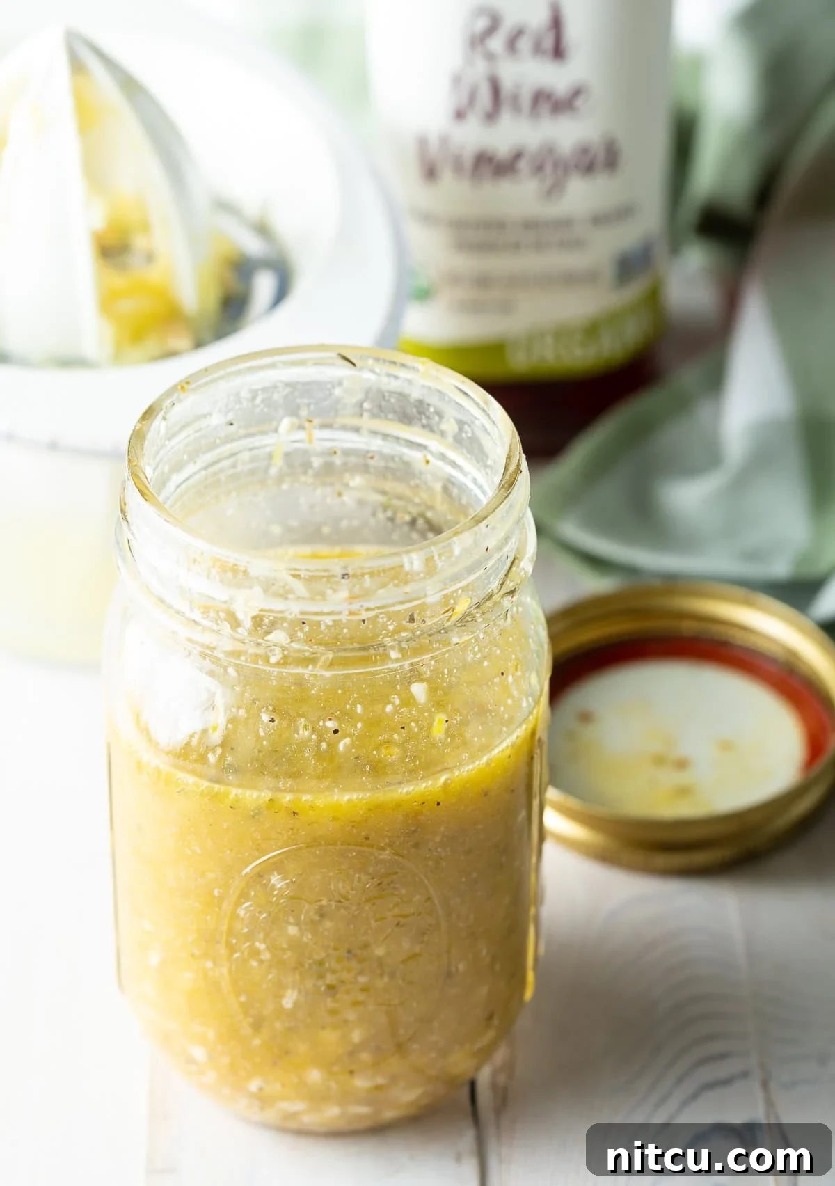 Zesty Greek Vinaigrette 8 Minced garlic cloves, showcasing the fresh aromatics used in the recipe.