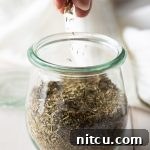 Homemade Italian Seasoning in a small jar.