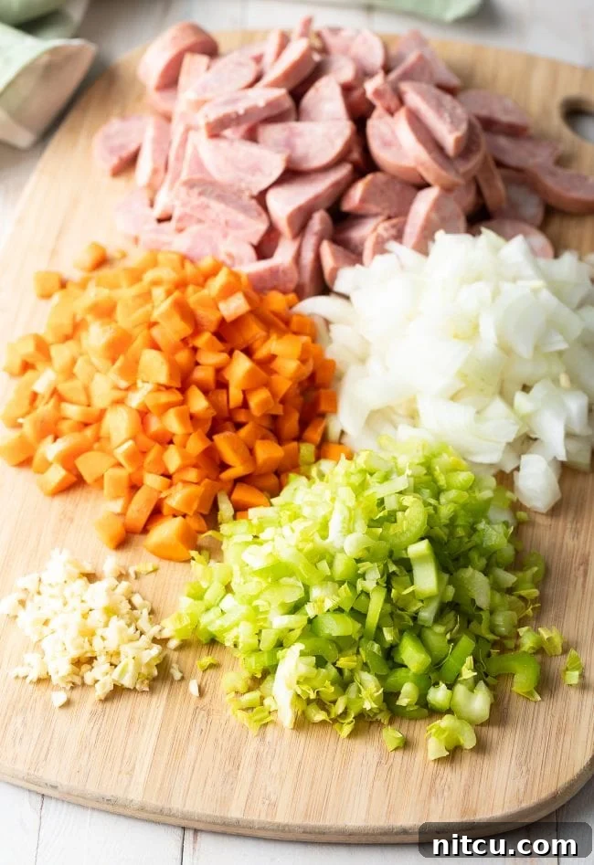Classic Carolina Chicken Bog 5 sausage, carrots, onion, celery, and garlic