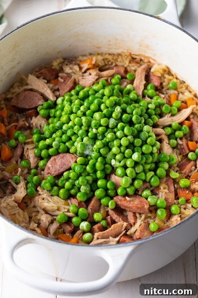 Classic Carolina Chicken Bog 8 add peas to chicken rice pilaf at end