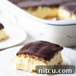Delicious Eclair Cake with Chocolate Ganache, a perfect no-bake dessert.