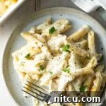 Cheesy Chicken Alfredo Pasta Bake, a delicious and comforting casserole.