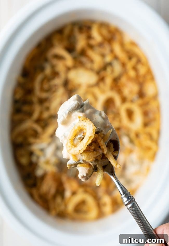 Ultimate Cream Cheese Slow Cooker Green Bean Casserole 4 Close-up of the creamy Green Bean Casserole mixture with cream cheese, sour cream, and frozen green beans, ready to cook in the crockpot.
