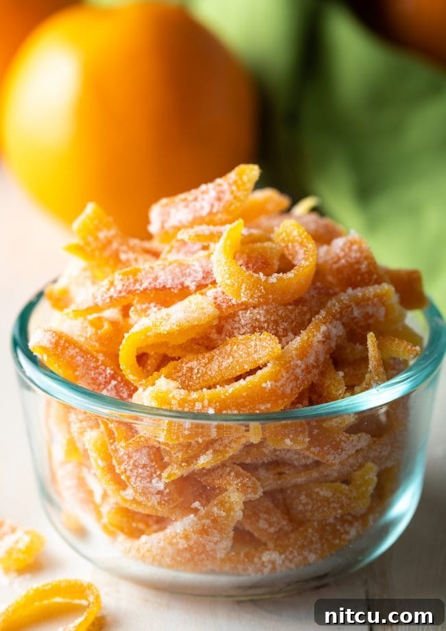 Orange Peel Confections 9 Close up view of the easy candied orange peel recipe presented beautifully in a small glass bowl.