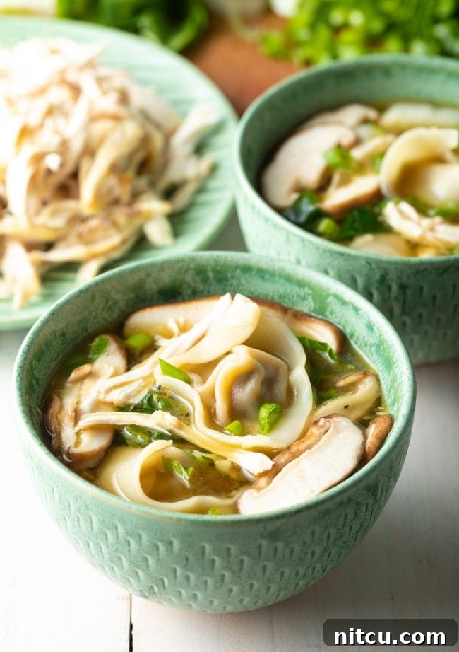 Ultimate Wor Wonton Soup 15 Close-up view of steaming hot Wor Wonton Soup served in elegant bowls.