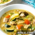 Instant Pot Green Chicken Curry in a white bowl, ready to serve.