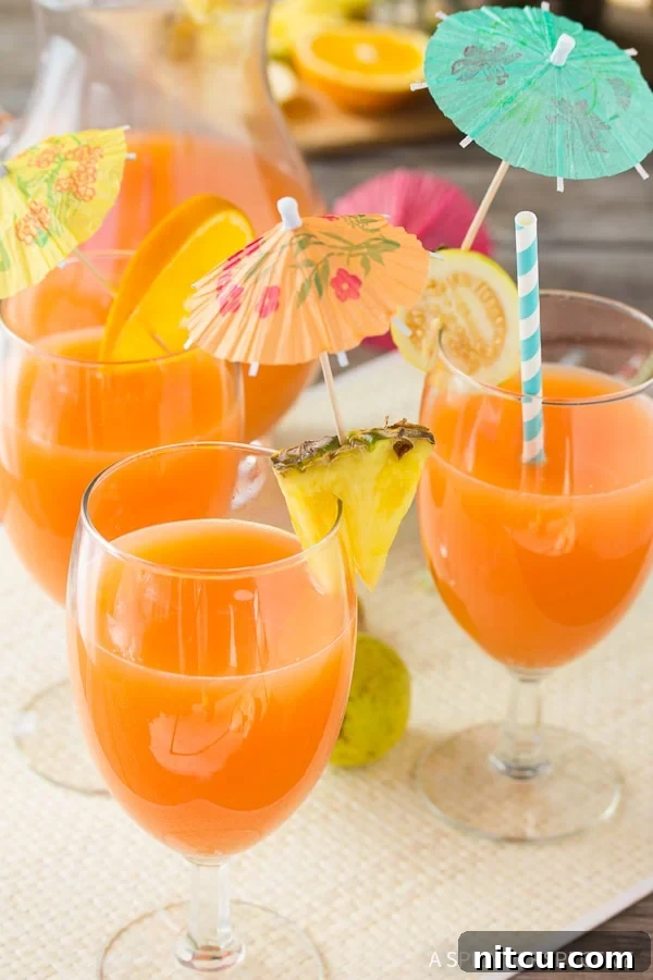 POG Punch Hawaiian Cocktail with Tropical Garnishes