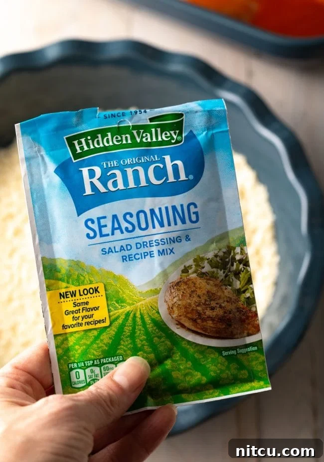 A single packet of dry ranch dip mix, ready to be incorporated into the breading mixture.