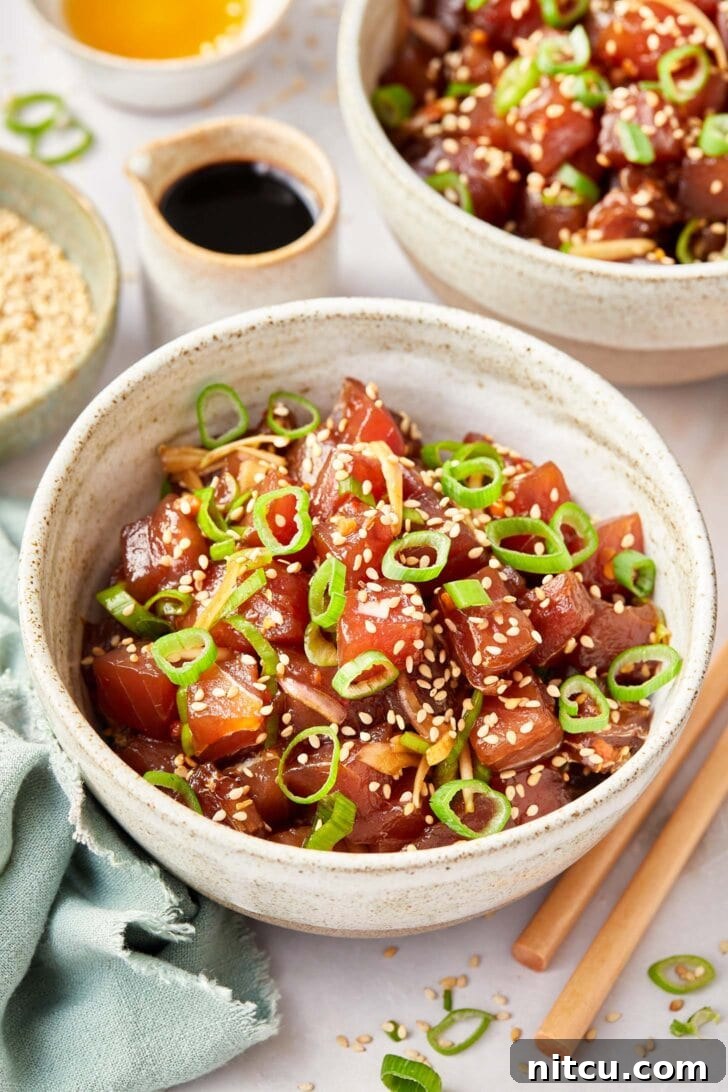A bowl of freshly prepared poke, elegantly presented and garnished, symbolizing a delightful culinary experience.
