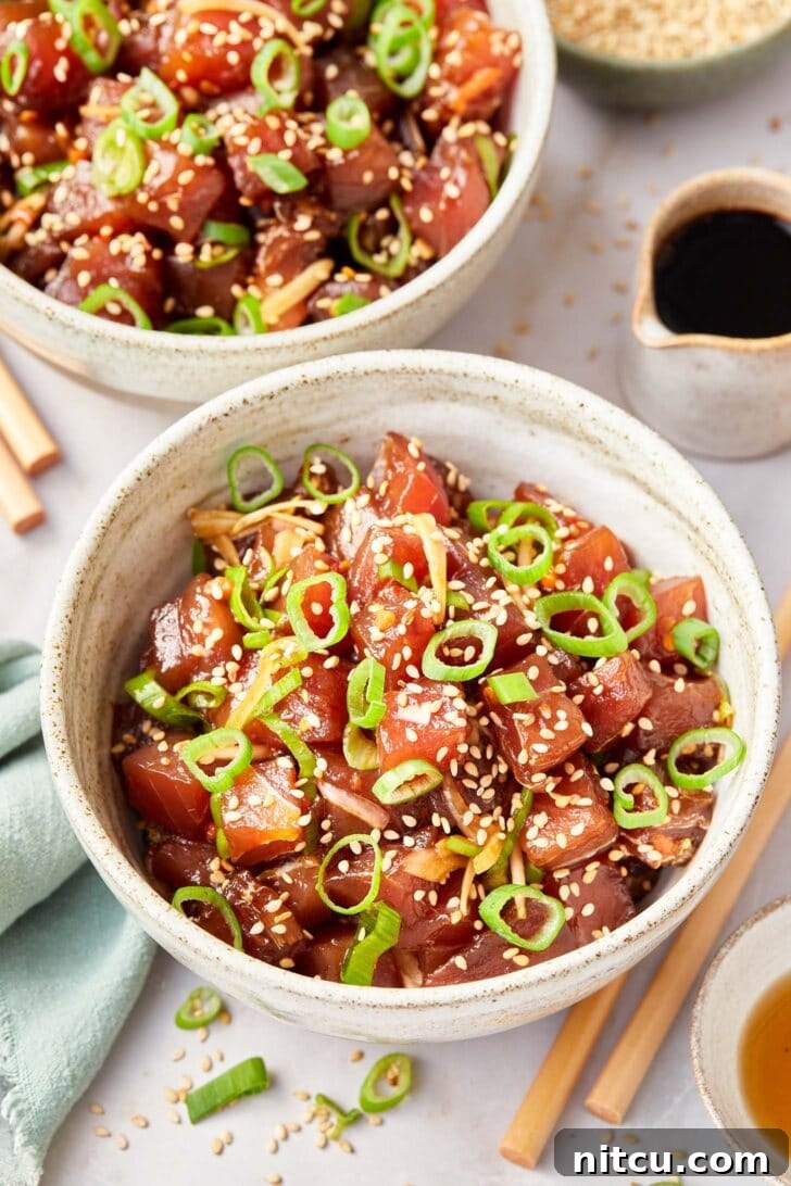 A bowl of vibrant Ahi Poke, garnished and ready to be served, capturing its fresh and appetizing presentation.
