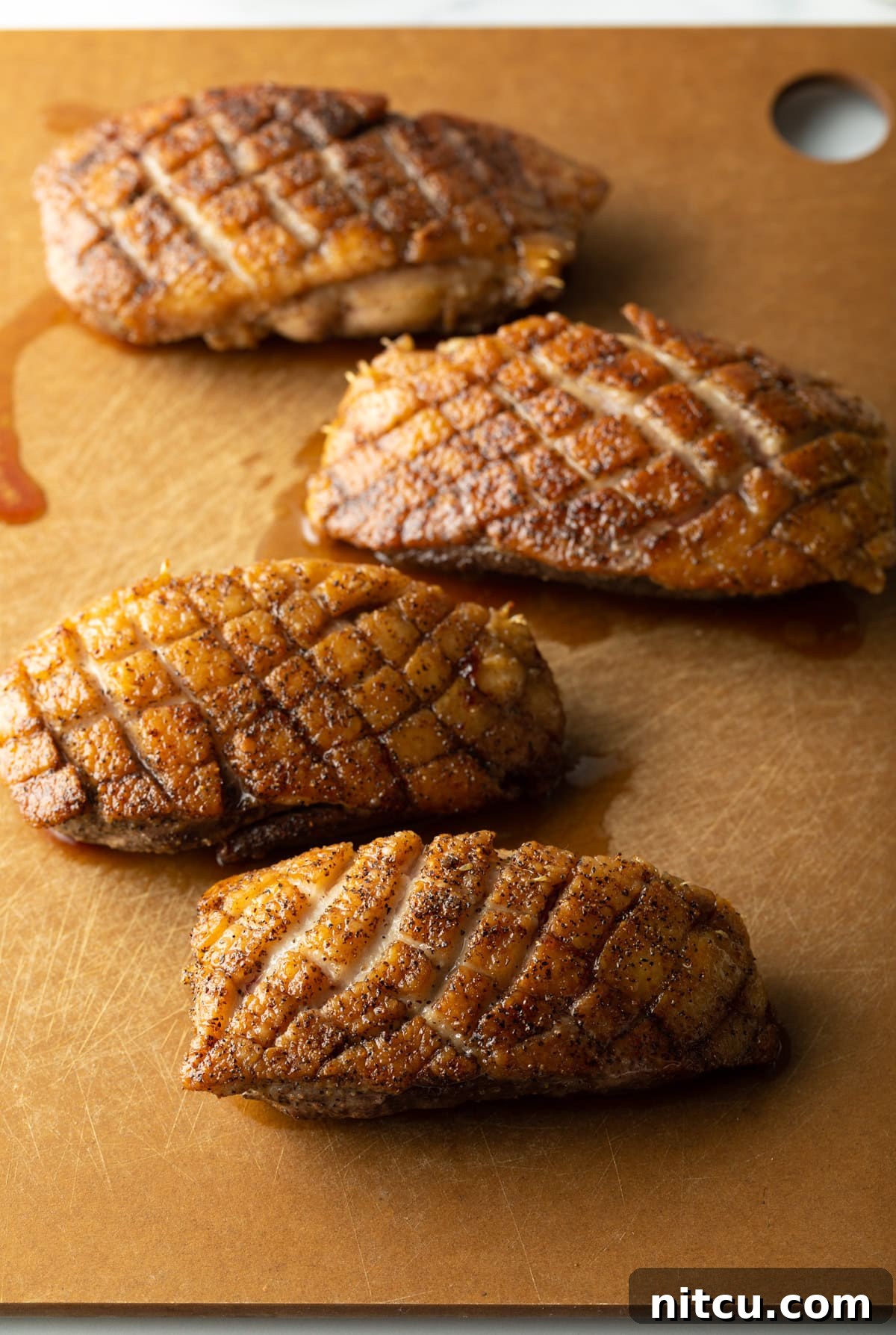 perfectly seared duck breast with golden crispy skin
