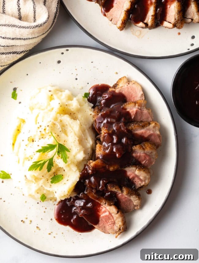 best duck breast recipe - overhead shot on plate with potatoes