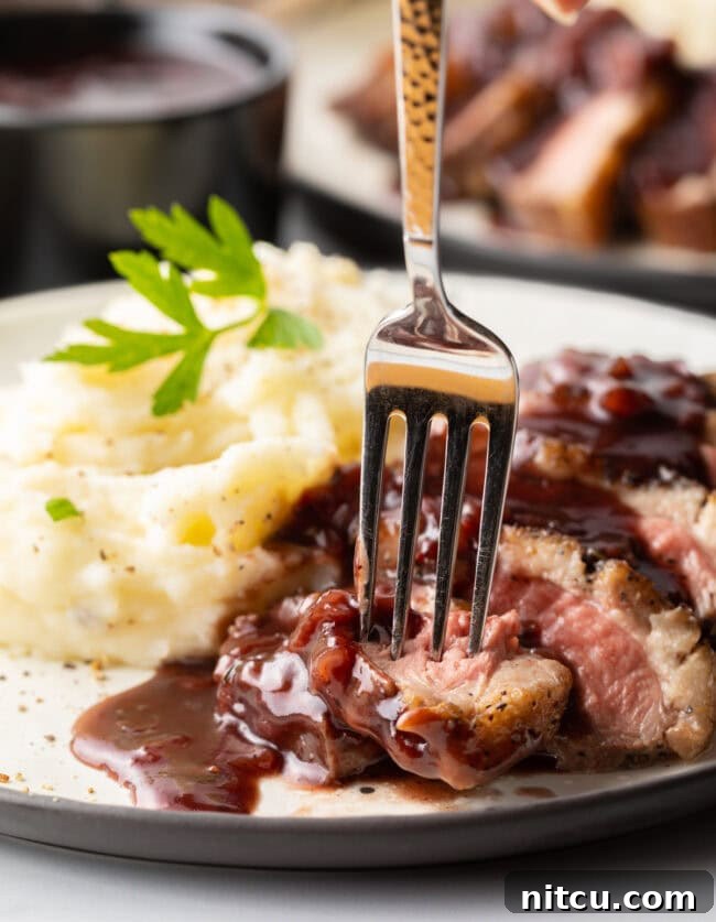 best duck recipe - fork picking up slice of duck breast