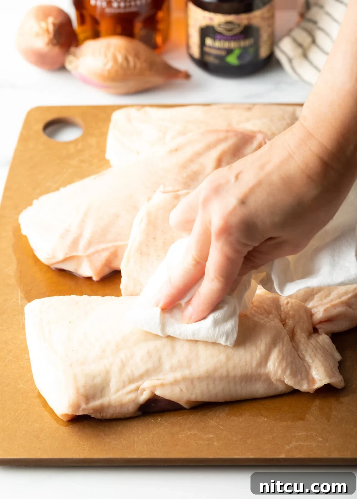 patting duck breasts dry for searing