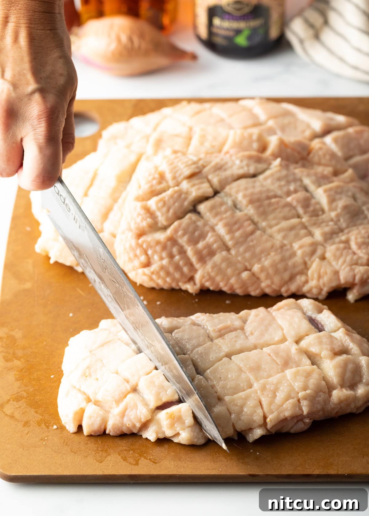 scoring duck fat in a criss-cross pattern