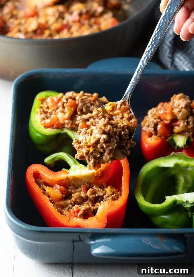 Savory Keto Bell Pepper Boats 7 filling each pepper with meat and cheese filling