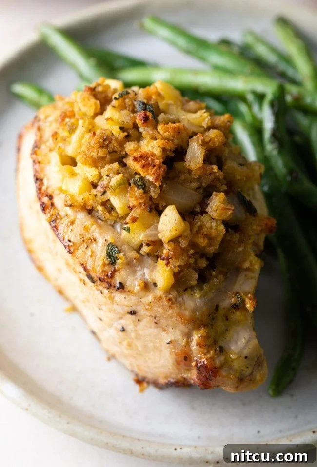 stuffed pork chops Top shot of this stuffed pork chops recipe with apple and cornbread filling and a side of green beans